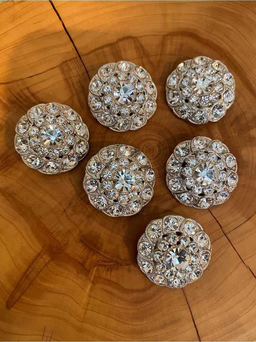 Six rhinestone buttons. On the heavy side, single hole. Gorgeous bling!